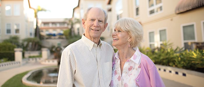 Portrait of a smiling couple outside Carlsbad by the Sea