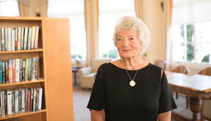 Portrait of a woman sitting in a library at Carlsbad by the Sea