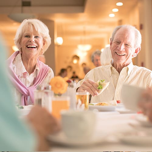 Senior residents enjoying food at Carlsbad by the Sea