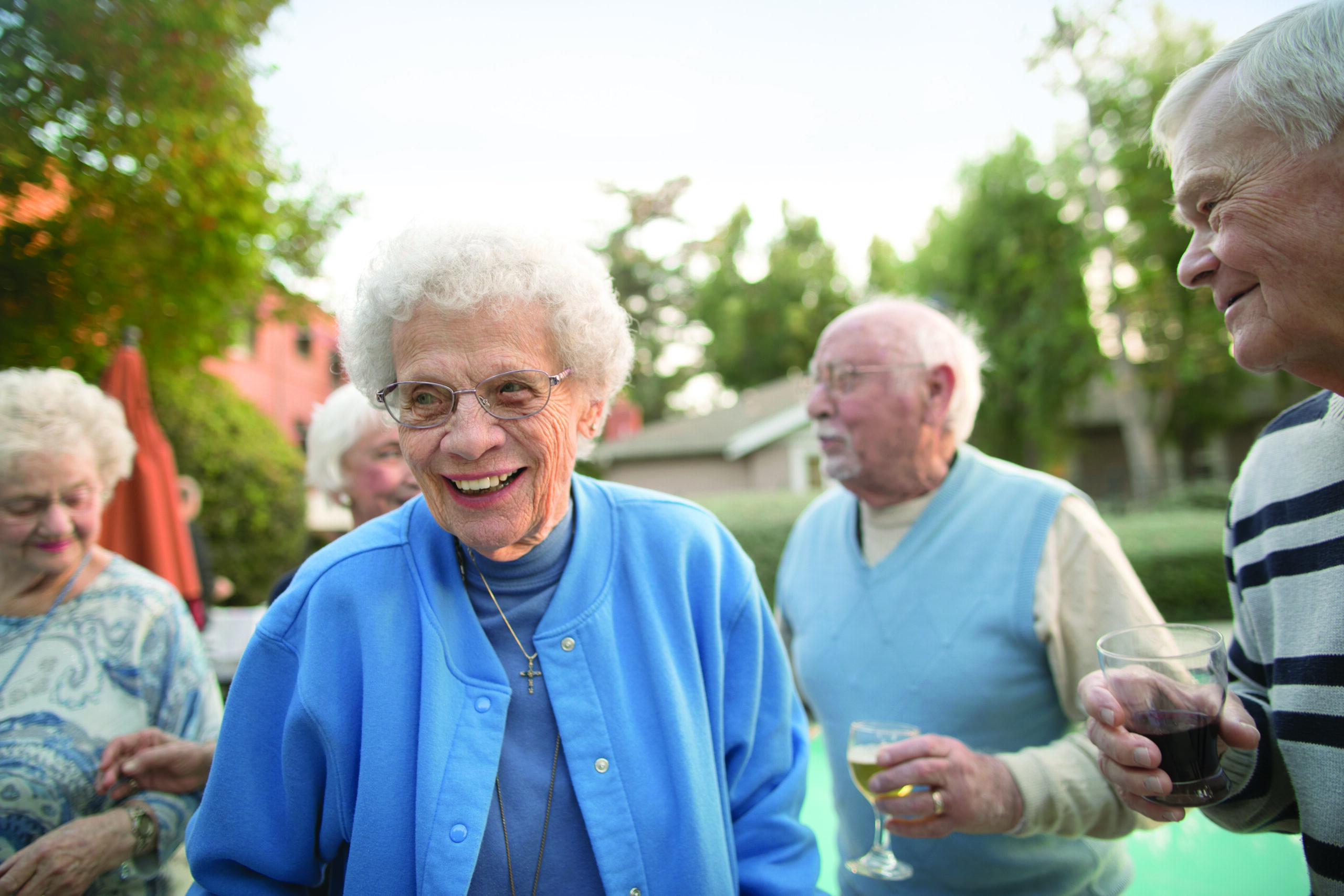 Portrait of a smiling group enjoying the Claremont Manor social activities