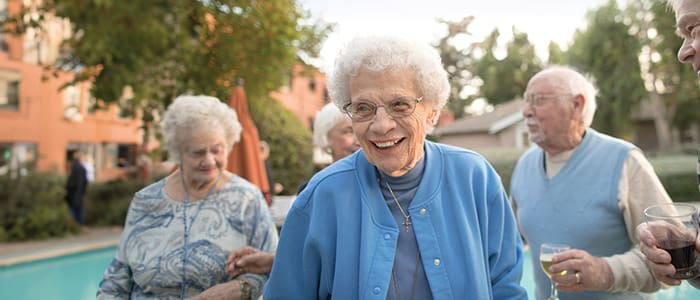 Portrait of a smiling group outside Claremont Manor