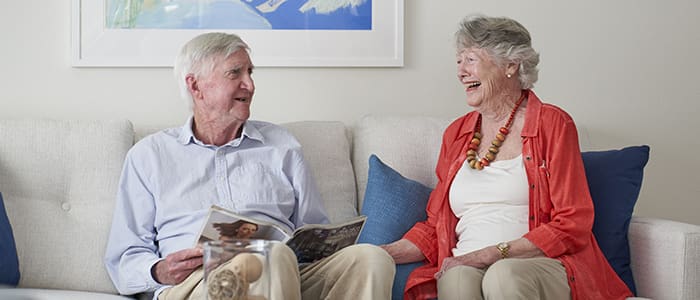 Portrait of smiling couple in Canterbury Woods home