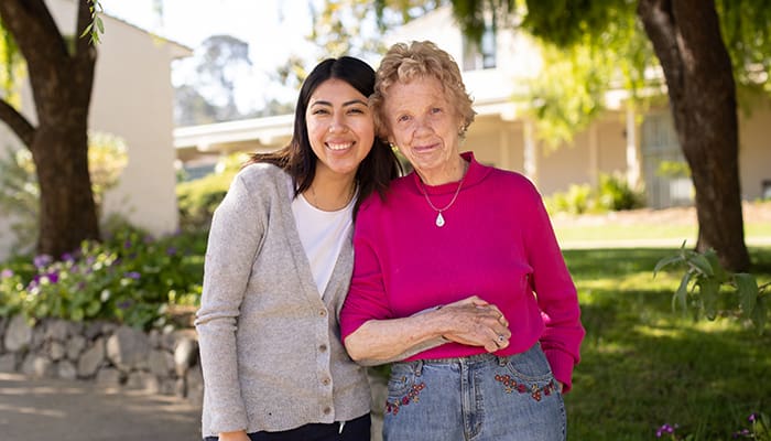 Portrait of smiling staff member and resident at Canterbury Woods