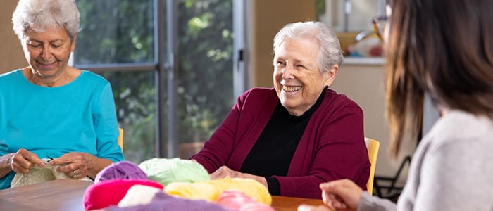 Portrait of smiling group during a knitting class