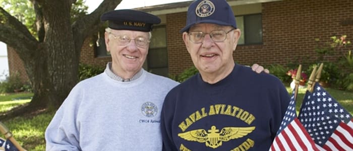 Photograph of two residents outside England Oaks community