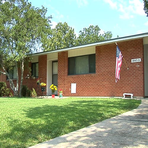 An exterior view of an England Oaks home