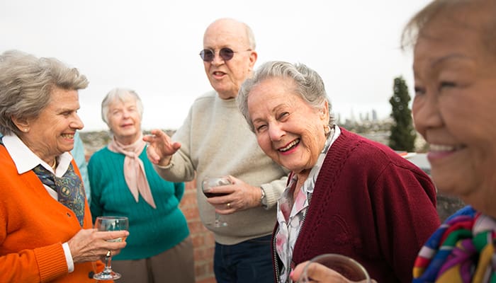 Portrait of a smiling group enjoying one of the many activities offered at Kingsley Manor