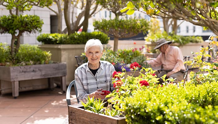 San Francisco Towers volunteer photographed in the garden