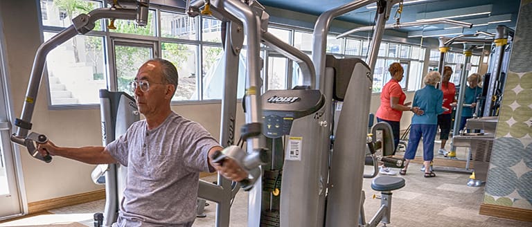 Residents using the fitness center at Vista Del Monte.