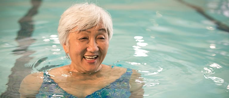 Resident enjoying the aquatic fitness center at Vista Del Monte.