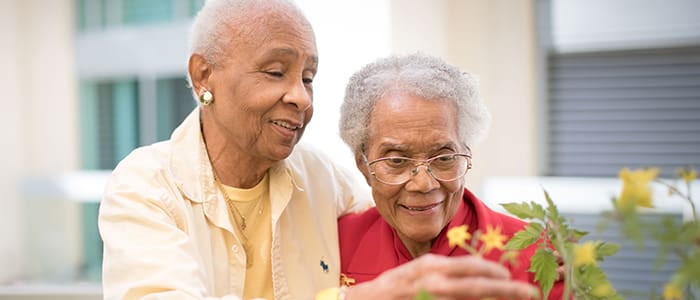 Portrait of smiling staff member and resident