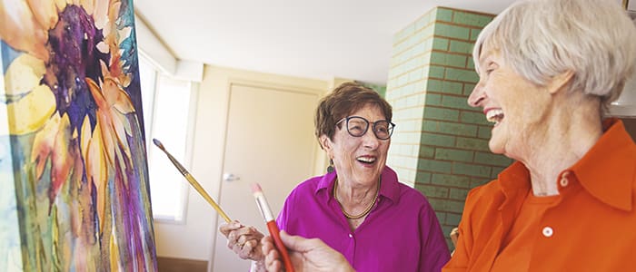 Portrait of smiling group during Villa Gardens painting class