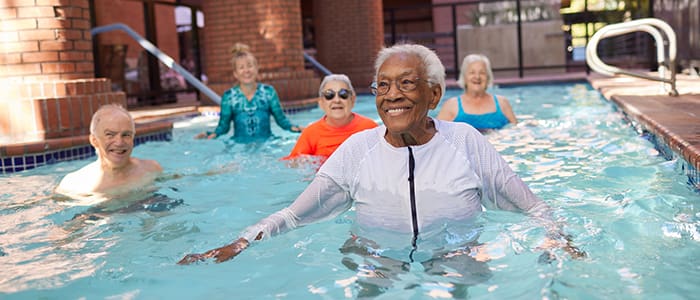 Residents taking part in aqua fit class at Webster House fitness center