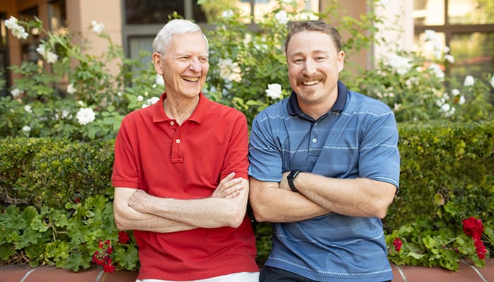 Portrait of smiling volunteer and resident at Walnut Village